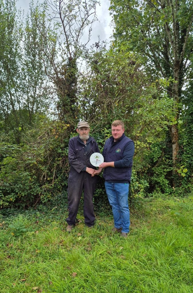 Scariff Mart Weanling Show and Sale Pascal O'Hallornan Bodyke receiving his prize for the Best CH Bull from Conor Nugent Clare Marts.